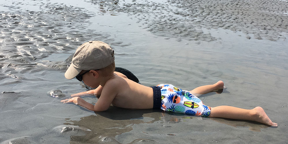 Playing in the sand Long Sands Beach.