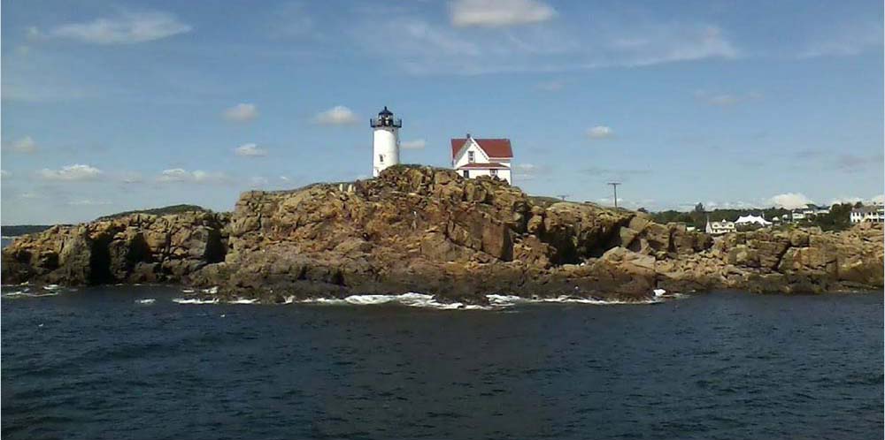 Nubble Light seen from the ocean side by boatr